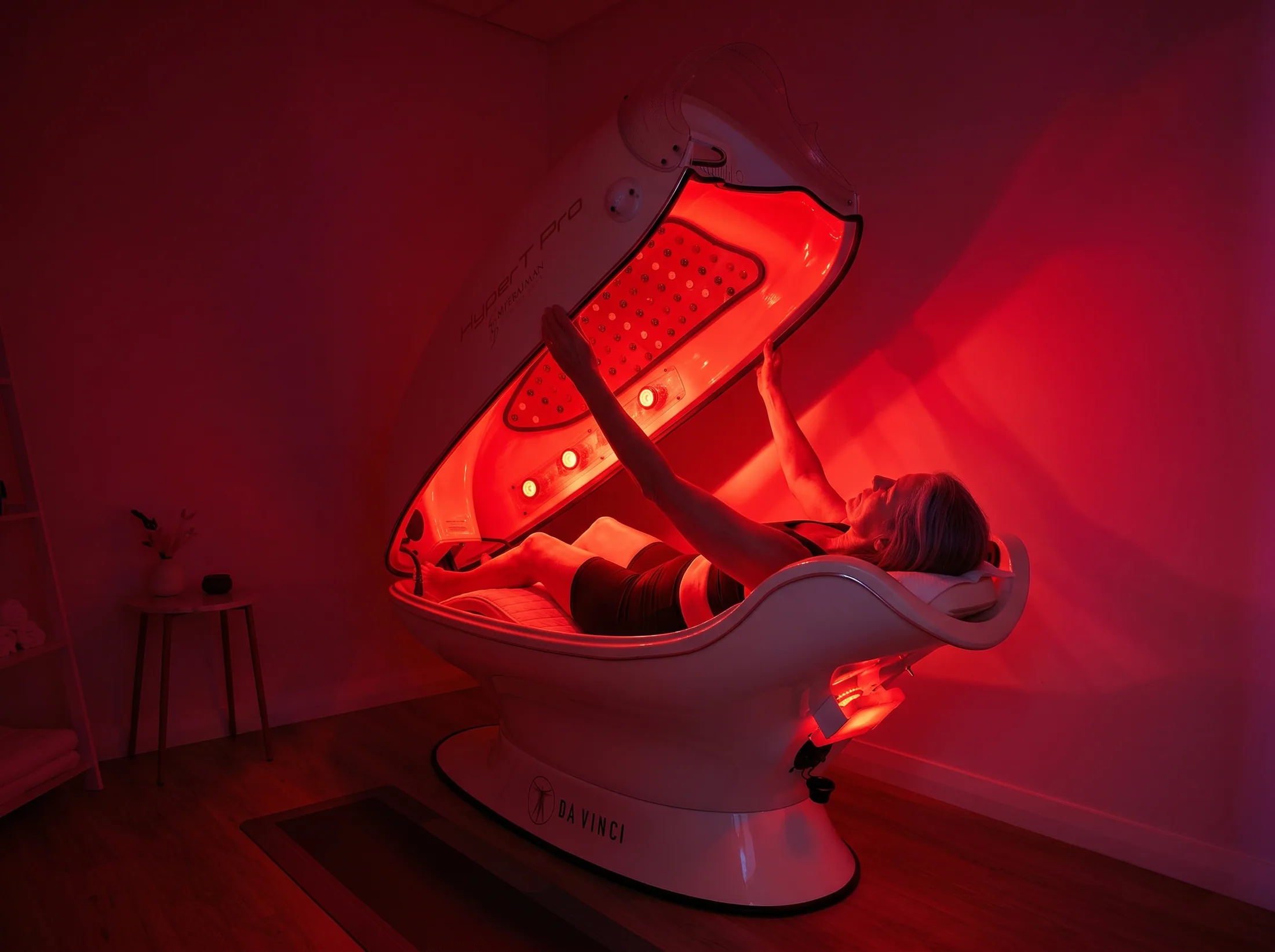Side view of a man relaxed inside the infrared sauna cocoon